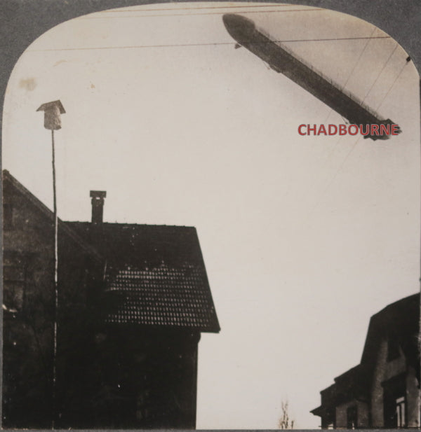 Stereoscopic photo of Zeppelin flying over German town c. 1923