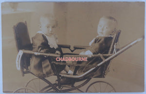 Early 1900s postcard photo of 2 infants in baby carriage