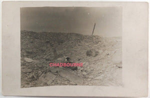 WW1 French photo postcard of a bleak battlefield with a KIA skull