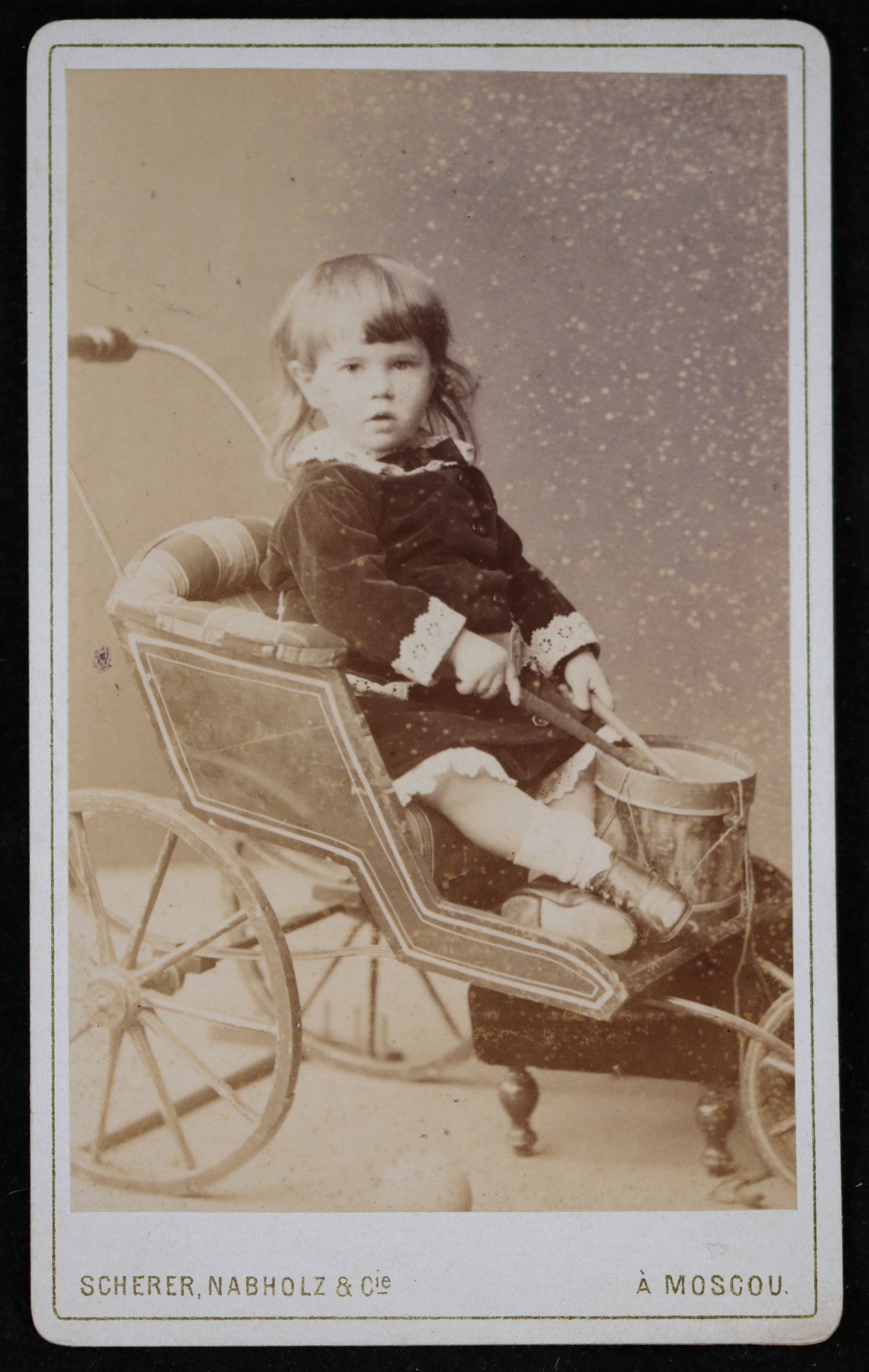 1884 Russian CDV child in stroller playing drum (Scherer Nabholz)