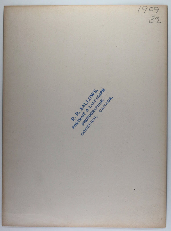 1909 Canada R.R. Sallows photo man on snowbank eating