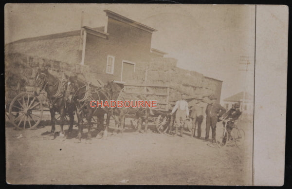 1910 USA photo postcard horse-drawn wagons of hay in town