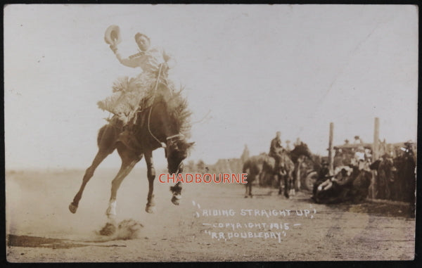 1915 photo postcard cowboy on a bucking bronco ’Riding Straight Up’