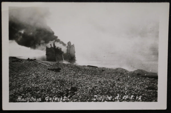 1942 WW2 photo of burning landing craft. on beach at Dieppe France