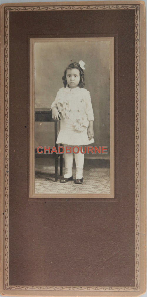 B&W photo of young African-American girl in dress, Abilene Kansas c.1910
