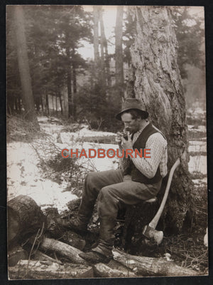 Canada R.R. Sallows 1907 photo man taking break after chopping logs
