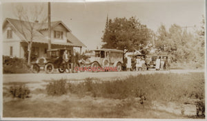 Early 1900s photo of hearse in front of house, with family and friends