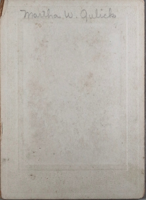 Early photo of identified young girl with doll