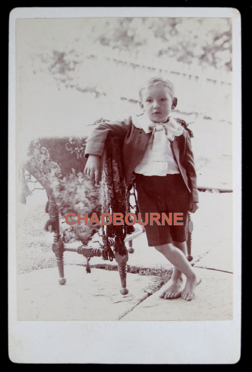 Late 1800s USA cabinet card photo of relaxed young boy