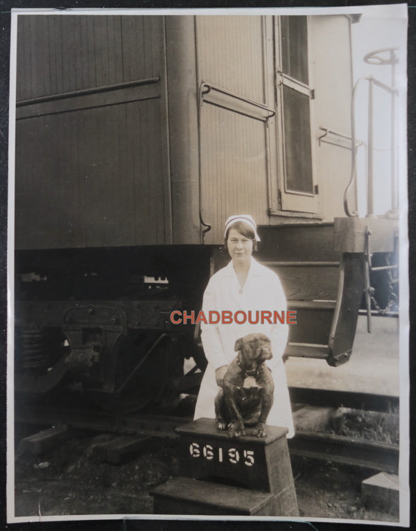 Photo CNR Red Cross coach nurse & mascot, Fort Frances Ontario c. 1930