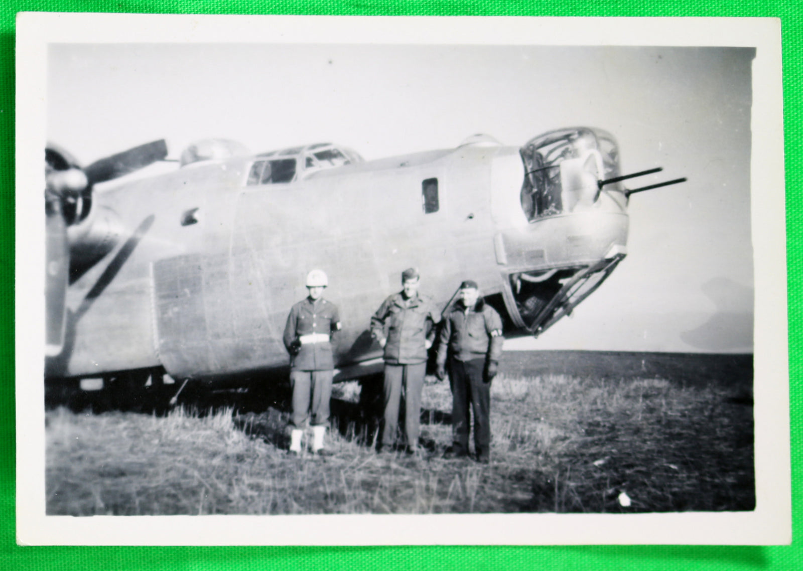 Photo of airman and two MPs in front B-25B on a grass field