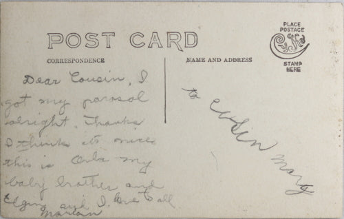 Photo postcard of 3 children with their toys c. 1910s