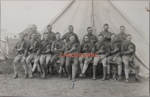 Photo postcard of US soldiers posing at bivouac c. WW1