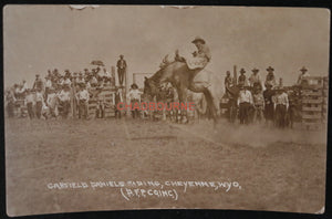 Photo postcard of Garfield Daniels on bucking bronco, Cheyenne WY c.1920