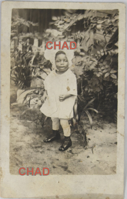 RPPC photo of African-American girl in bonnet, 1918-1930