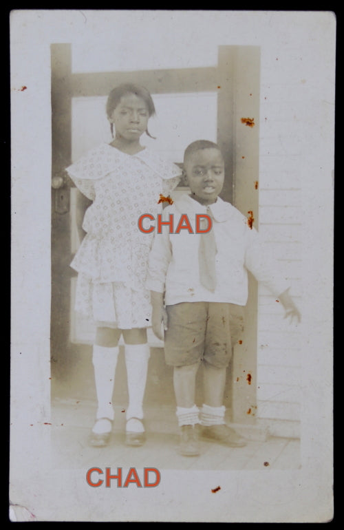 RPPC photo postcard of two African-American siblings c. 1930s