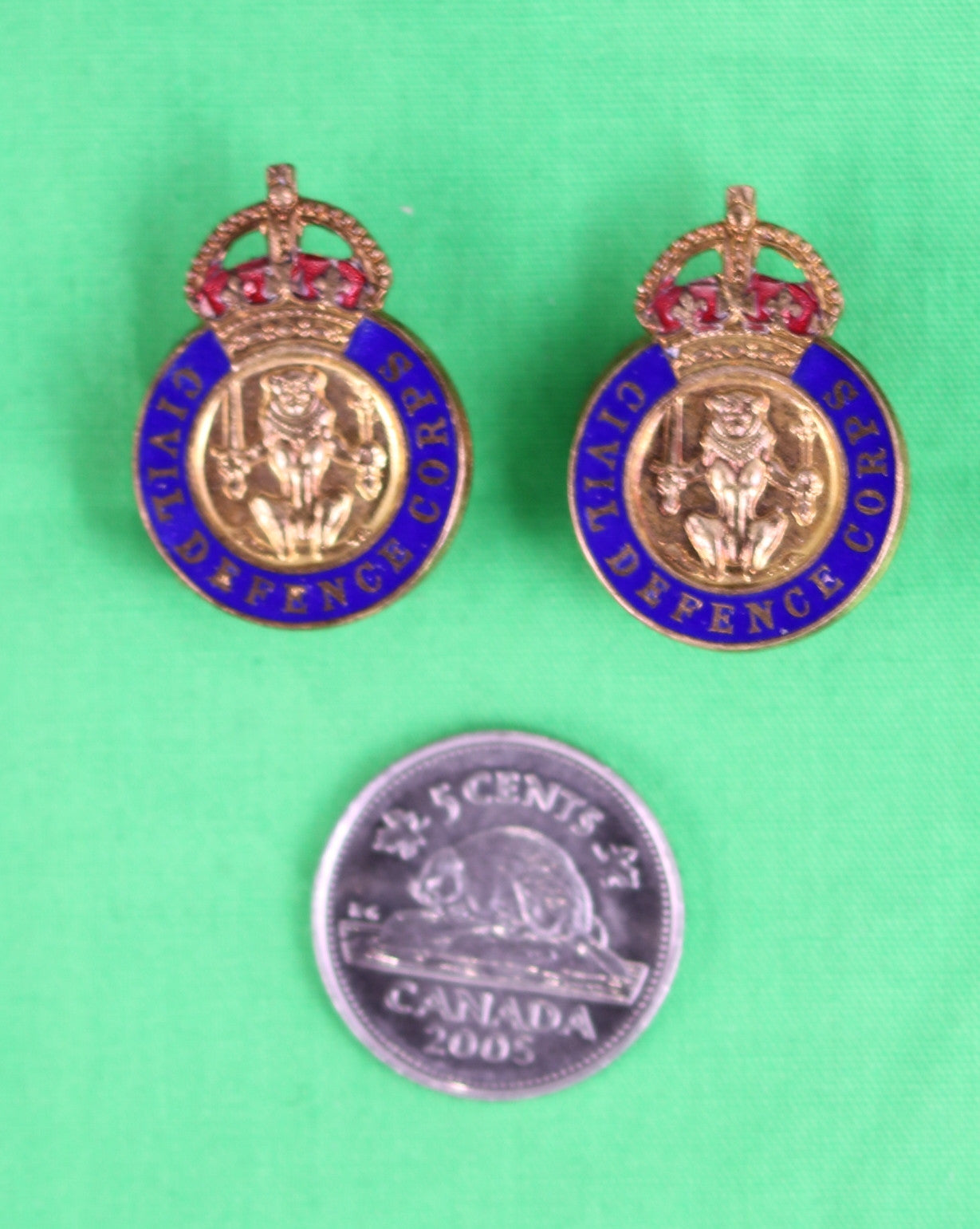 Set of 2 Civil Defence Corps (Scottish version) lapel badges in box.