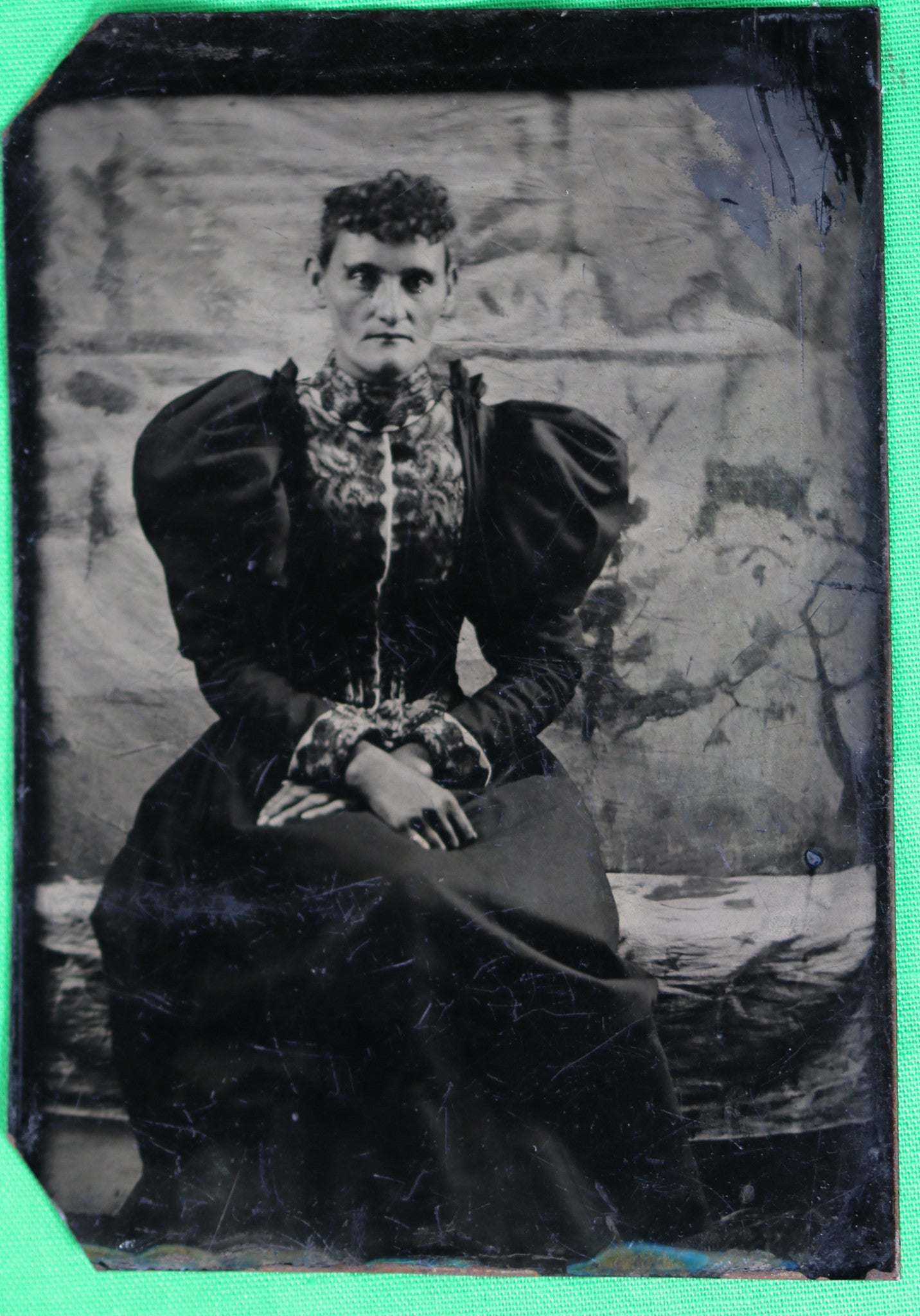 Tintype photo of lady in dress with balloon sleeves (1860s-1870s)