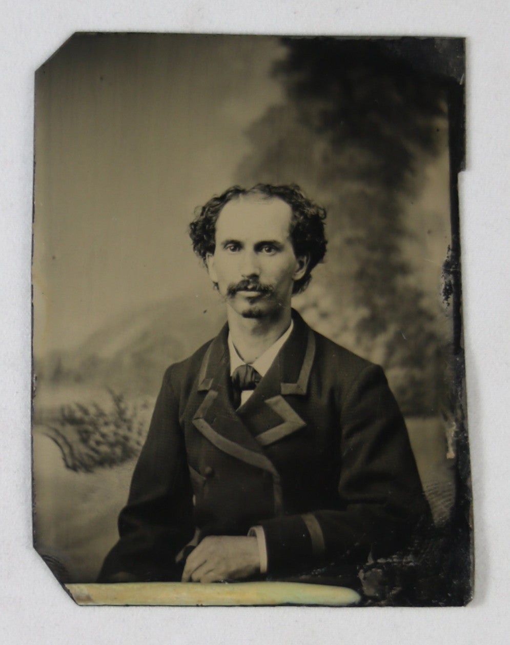 Tintype photo of man sitting, late 1800s