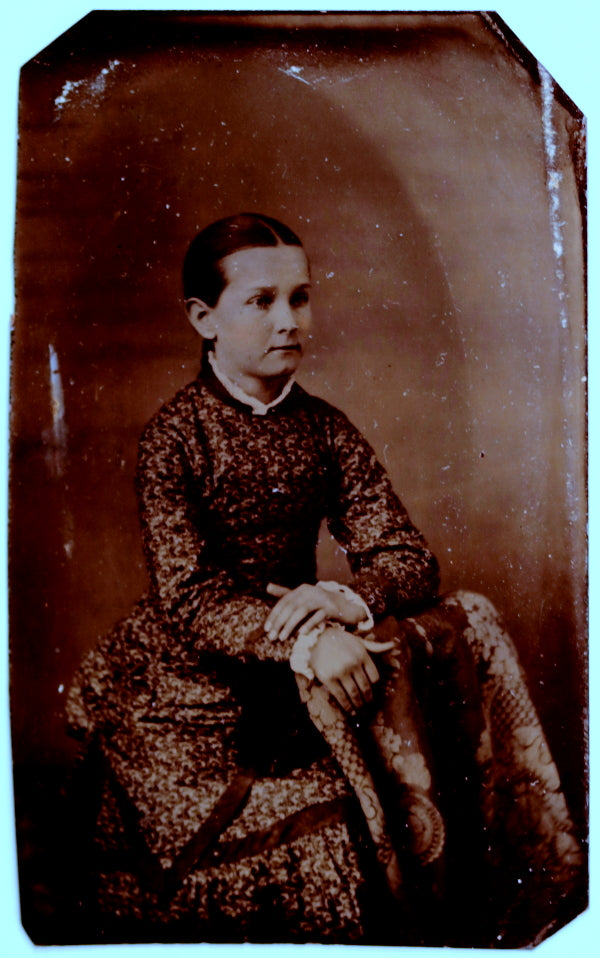 Tintype photo of sitting young girl in fancy dress (1860s-1870s)