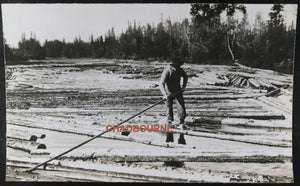 Two photos log drivers riding logs downriver, Foleyet Ontario c.1930