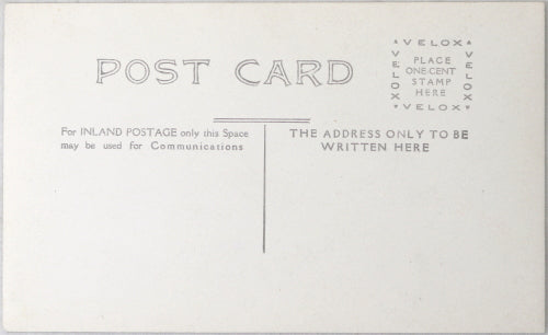 UK photo postcard of owner standing in front of liquor store c. 1910s