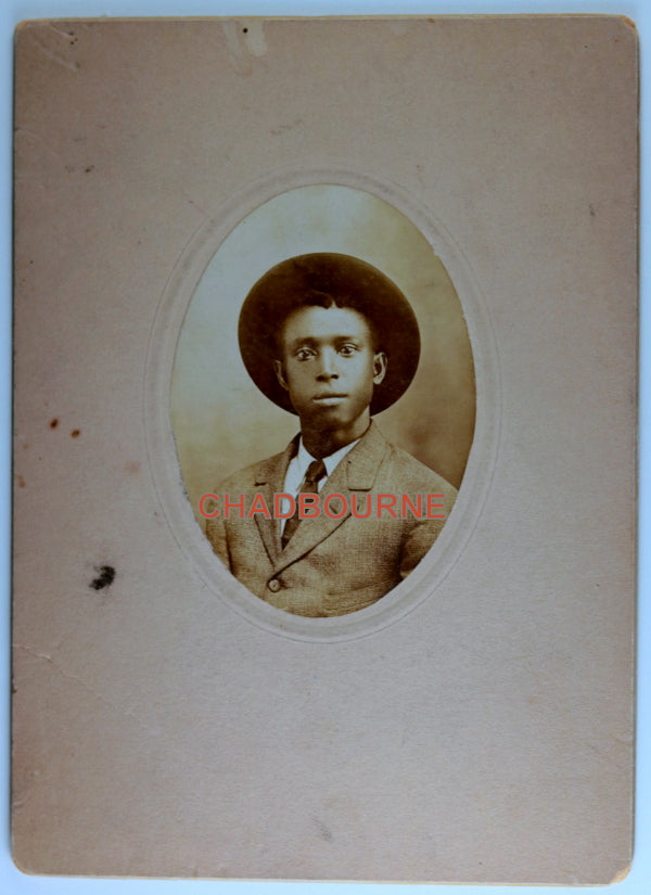 Vintage B&W photo of African-American young man wearing hat