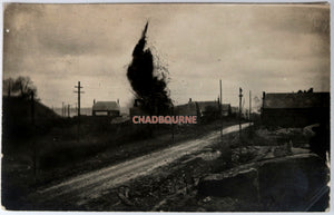 WW1 1917 German photo postcard, shell exploding in village