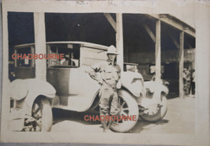 WW1 photo of American soldier leaning on car fender, St Nazaire France