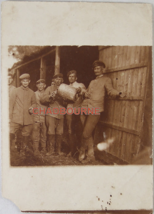 WW1 photo of German soldiers relaxing outside wood shelter
