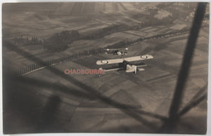 WW1 postcard photo of two allied biplanes in flight over France