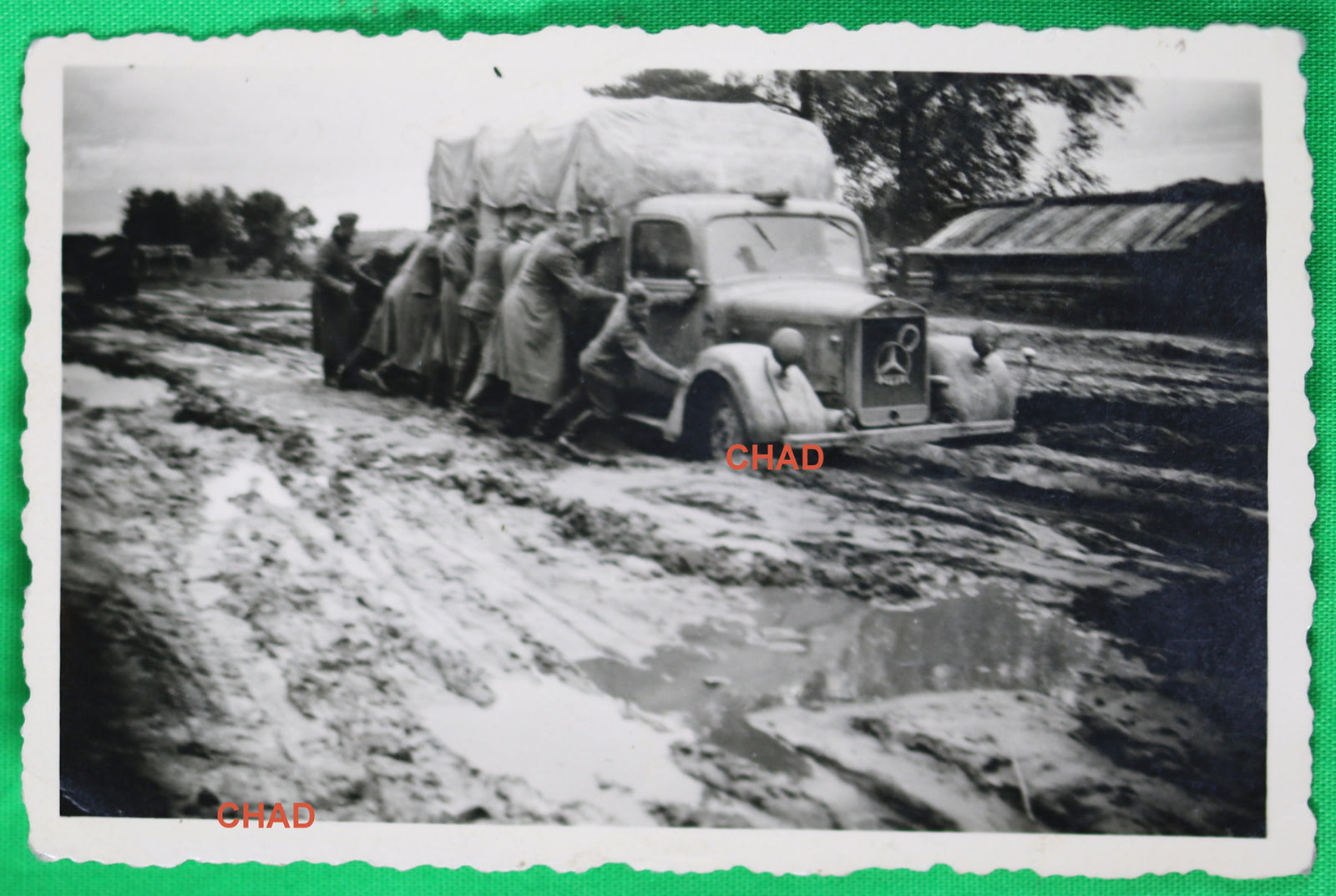 WW2 German troops pushing troop transport through mud in Russia @1941