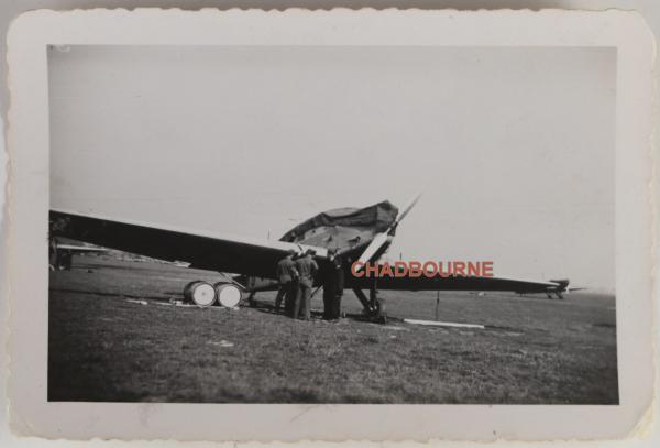 WW2 Photo of German personnel examining parked plane.