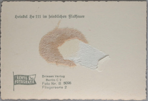 WW2 Propaganda photo of German Heinkel 111 bomber in flak