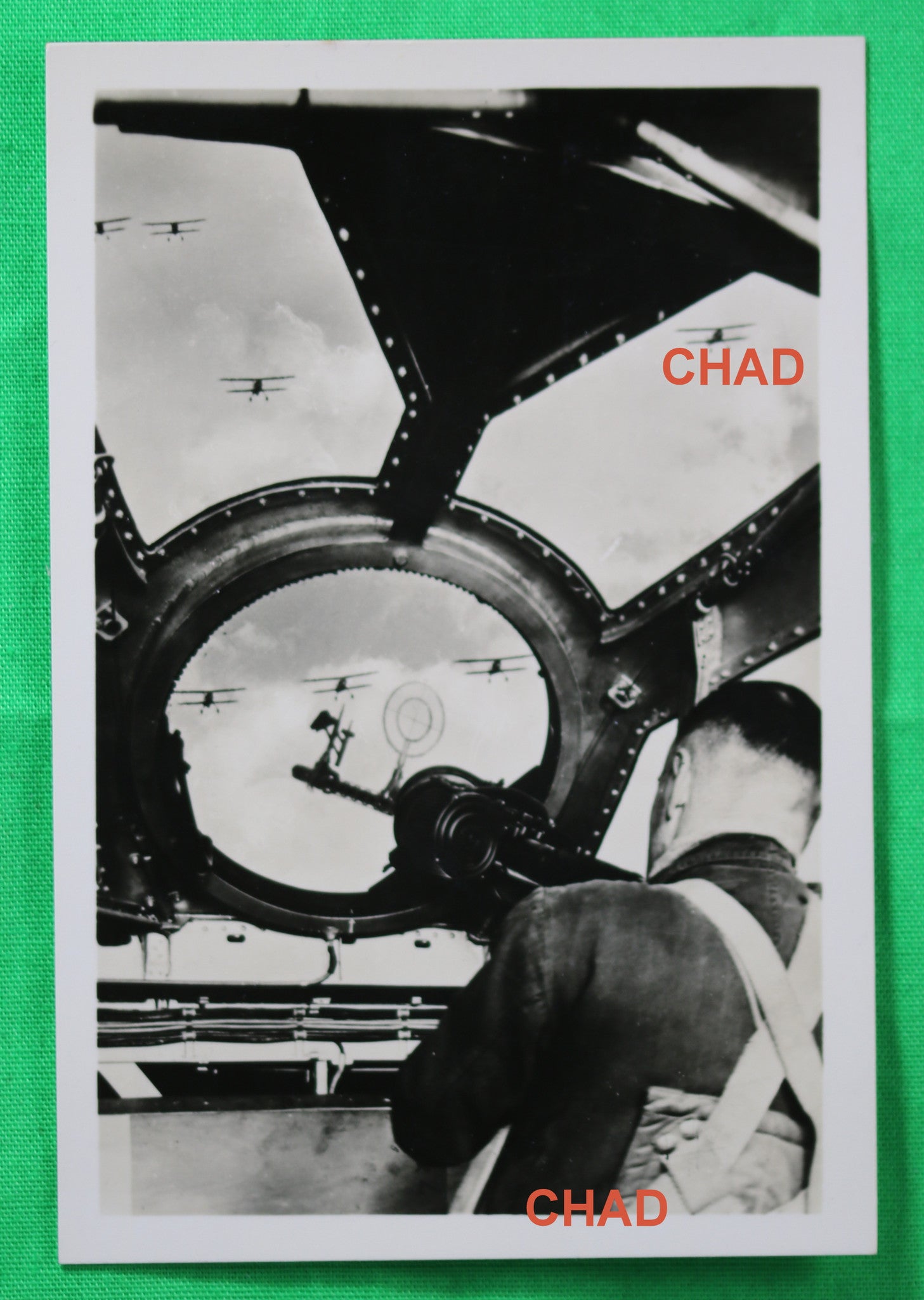 WW2 Propaganda photo of German Dornier 17 tail-gunner aiming at biplanes