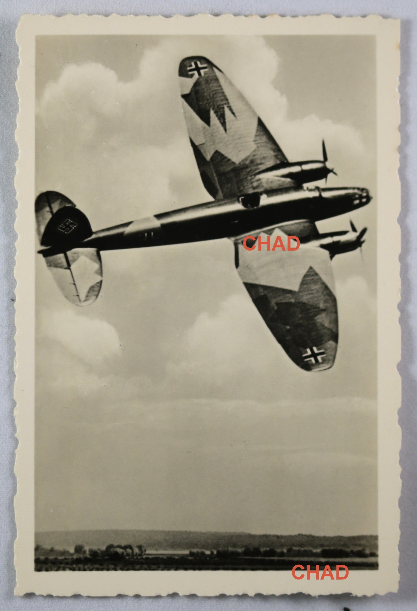 WW2 Propaganda photo of German Messerschmitt Me 109 in flight over countryside