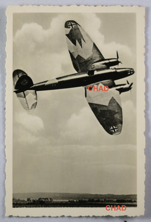WW2 Propaganda photo German Heinkel He 111 bomber banking over countryside