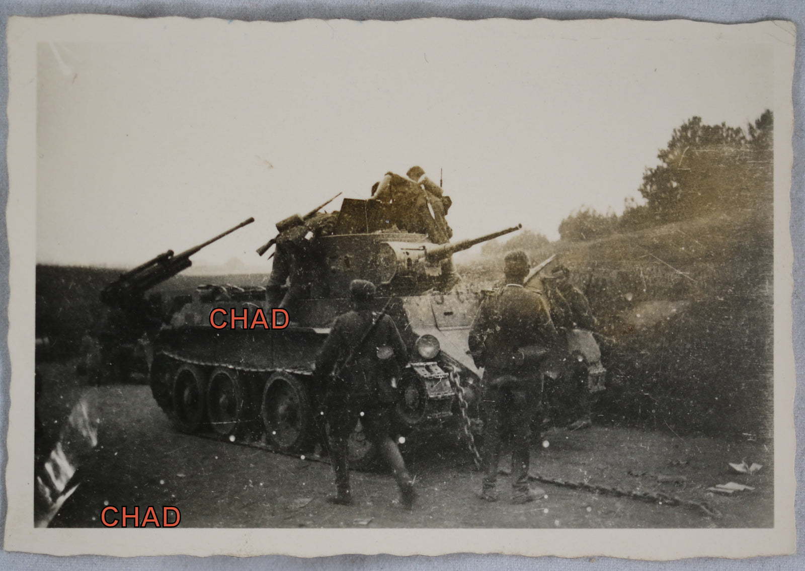 WW2 photo German soldiers inspecting Russian light tank