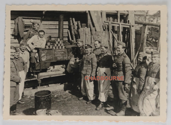WW2 photo of German soldiers lined up for meal (POWs)