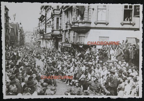 WW2 photo of crowd watching German troops