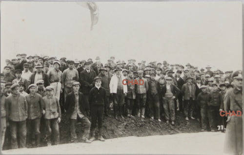 WW2 photo postcard of workers in front of stage, German officer
