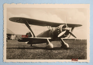 WW2 propaganda photo of German Henschel 123 on grass runway