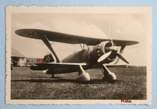 WW2 propaganda photo of German Henschel 123 on grass runway WW2 propaganda photo of German Henschel 123 on grass runway